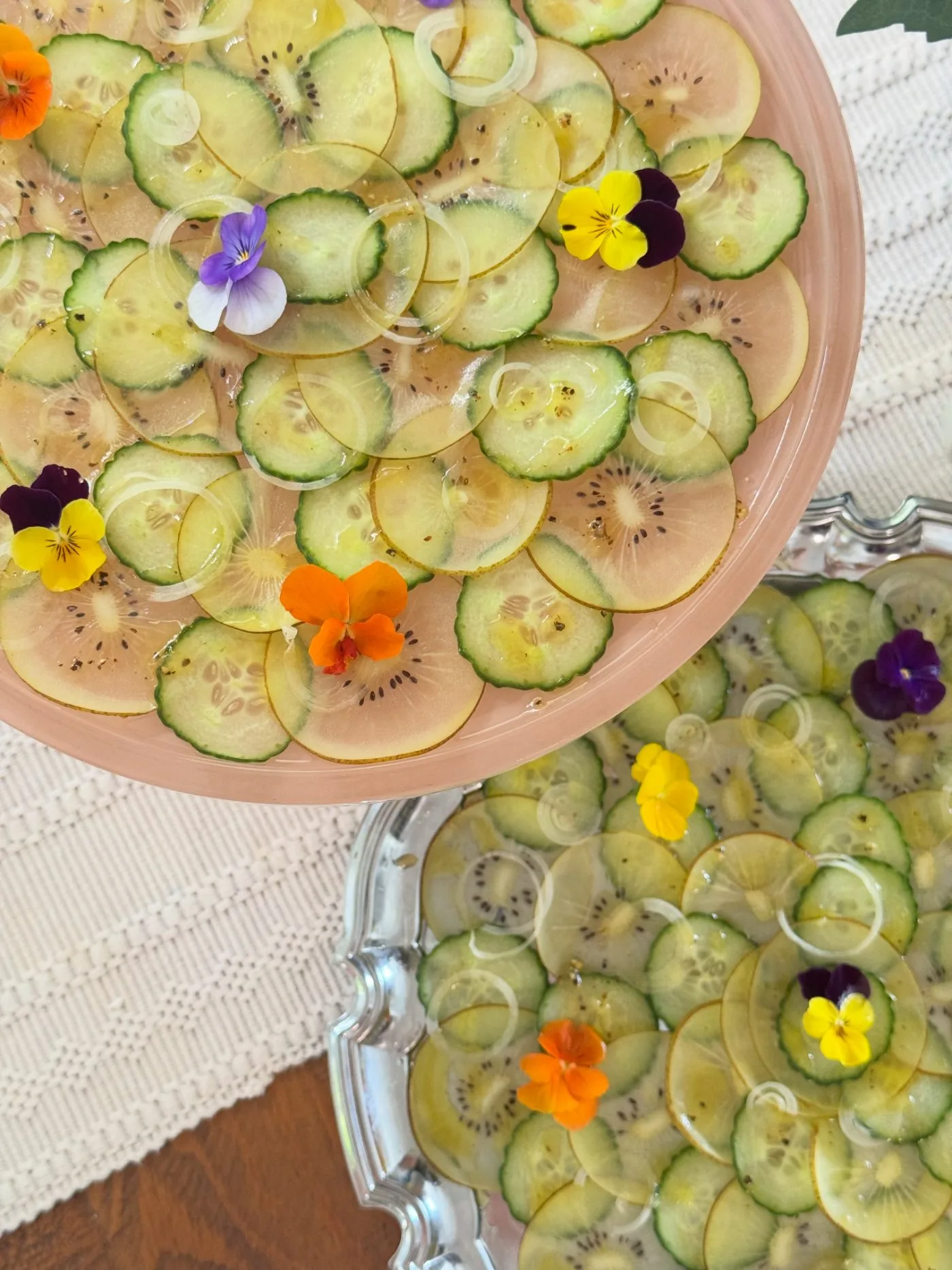 Cucumber and kiwi carpaccio with edible flowers
