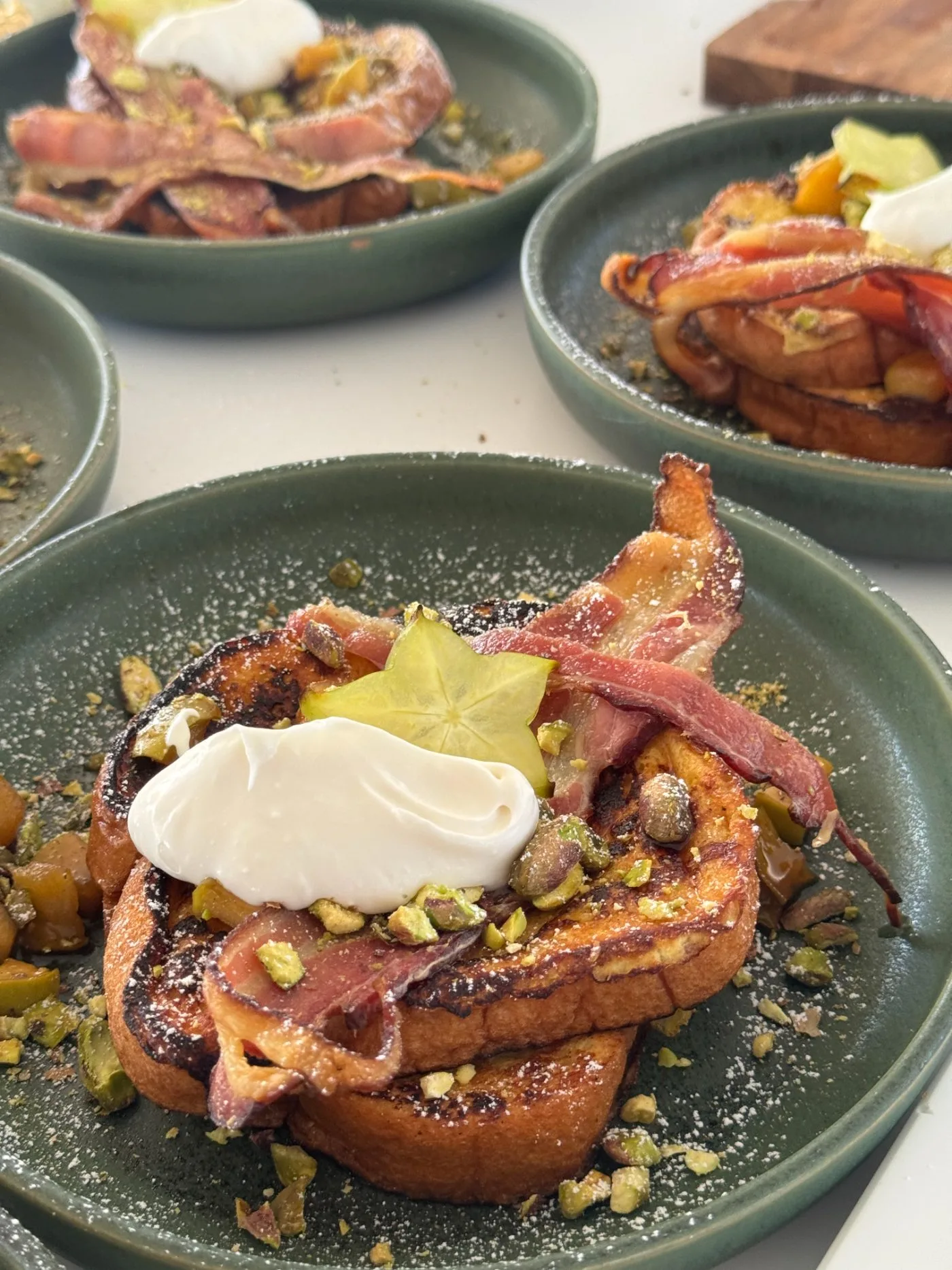 Spiced French toast with crispy bacon and pistachio