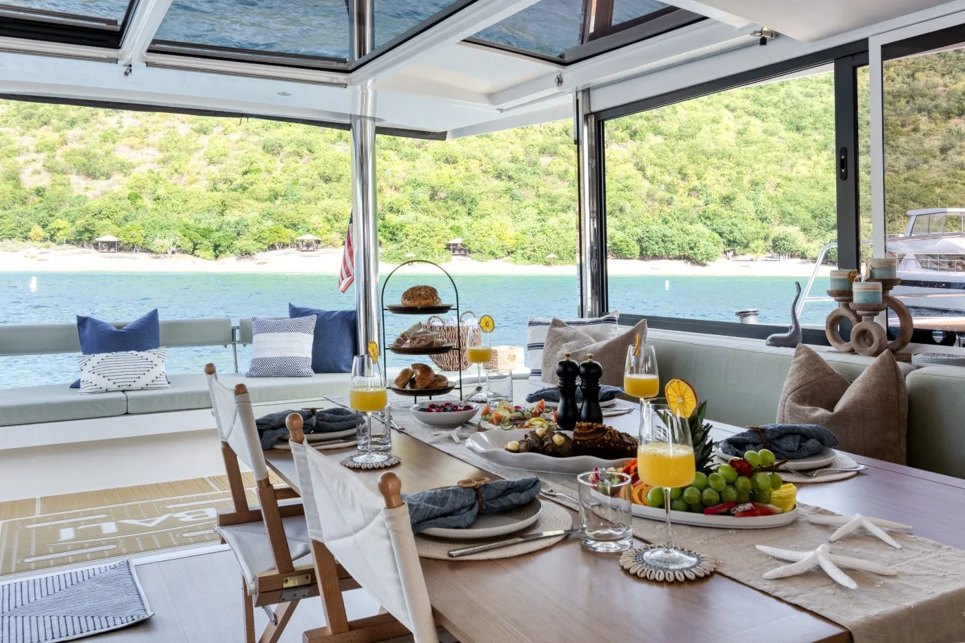 Breakfast table with panoramic coastal view through Allegra's salon windows