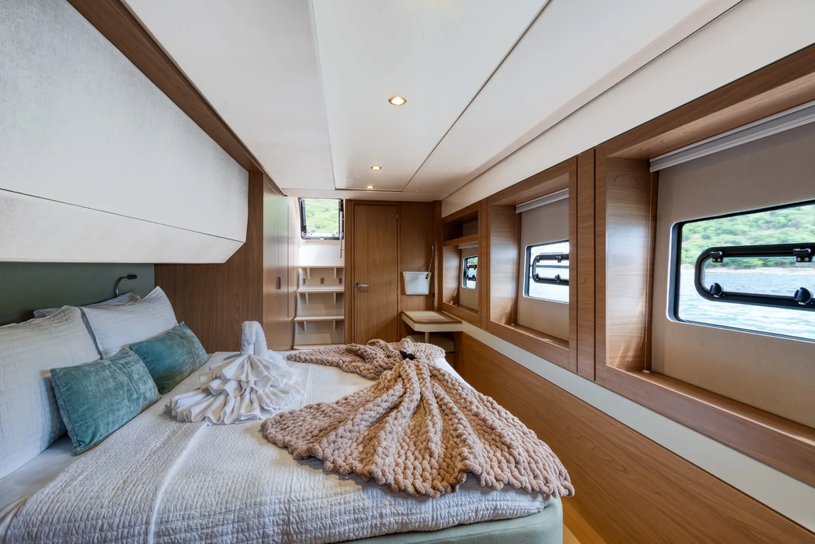 Allegra's master cabin with bay-side hull windows