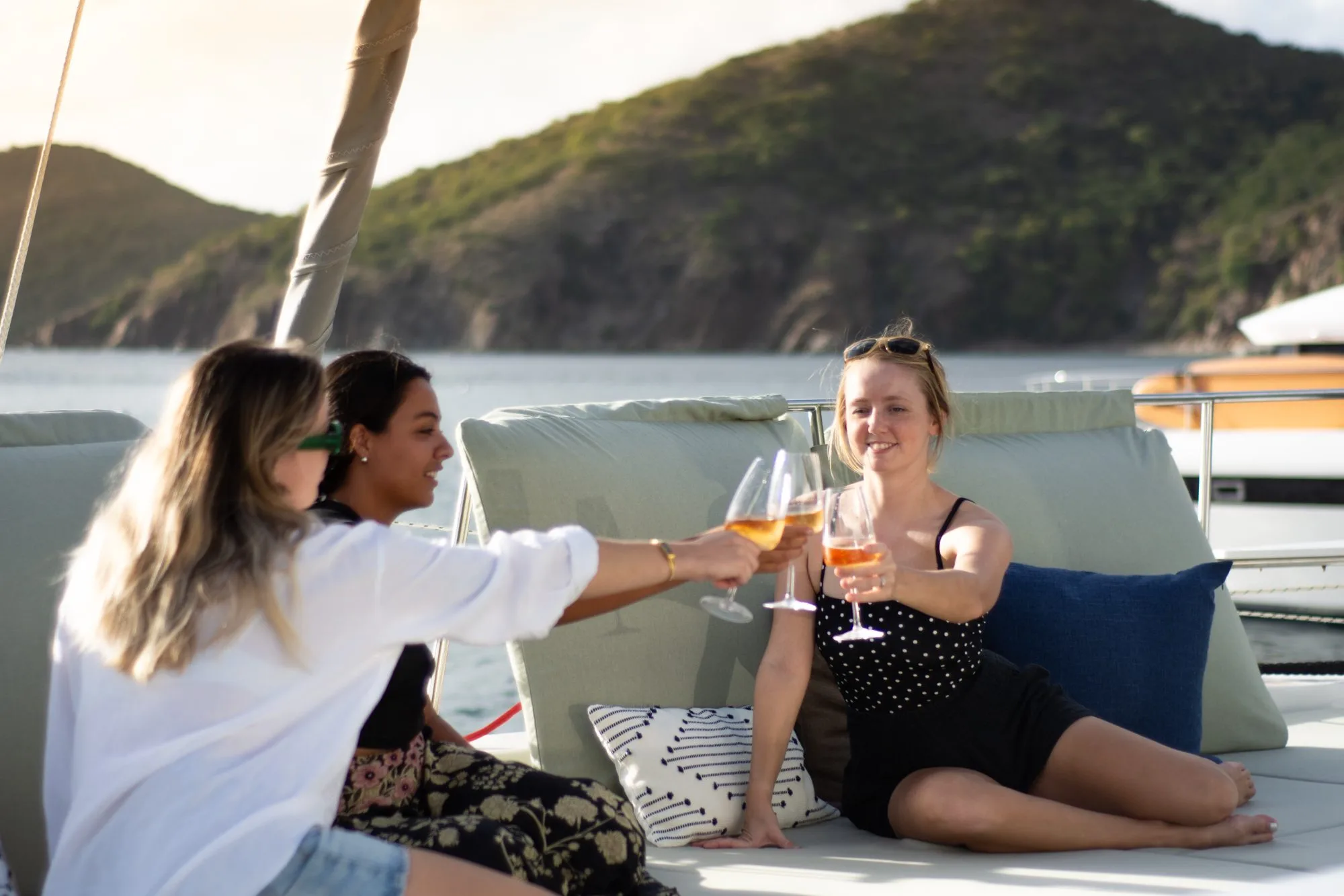 Guests sharing a sunset toast aboard Allegra